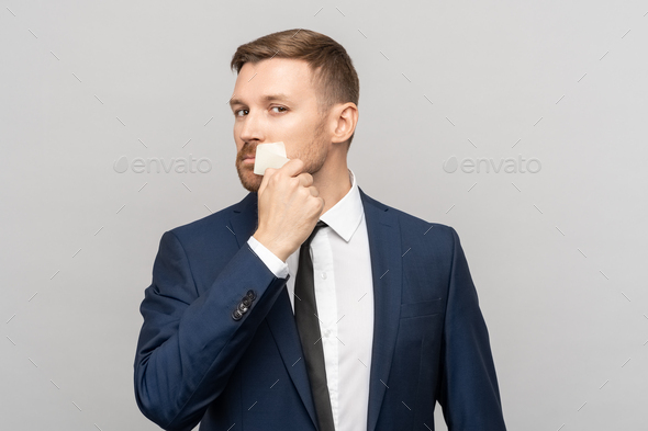 Employee man removes adhesive tape from lips looking at camera opening up new opportunities for life