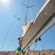 Sailboat crew folding the sail - PhotoDune Item for Sale