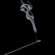 Smoke curls from burning incense stick for relaxation and meditation black background - PhotoDune Item for Sale