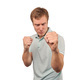 Angry young man in mint T-shirt ready to fight with fists isolated on white background - PhotoDune Item for Sale