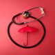 Top view stethoscope and red umbrella on a red background - PhotoDune Item for Sale