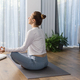 Young woman practicing meditation at home. Concept of mental health, women&#39;s wellness, mindfulness. - PhotoDune Item for Sale