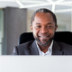 Mature adult african american businessman in middle of office working with laptop, close up man - PhotoDune Item for Sale