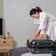 Portrait of beauty asian traveler woman pack prepare stuff and outfit clothes in suitcase travel - PhotoDune Item for Sale