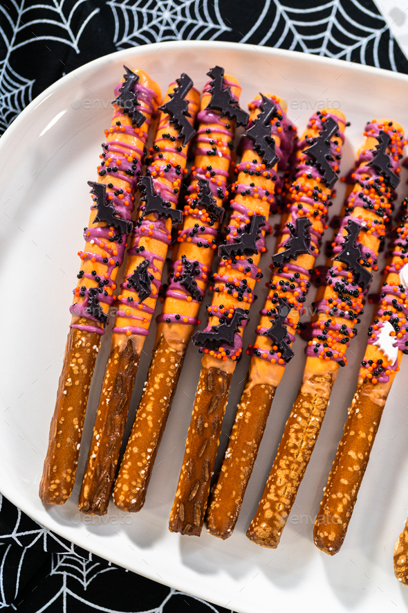 Halloween chocolate-covered pretzel rods Stock Photo by arina-habich