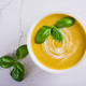 Close up of fresh zucchini soup with basil leaves in a bowl on the table top view - PhotoDune Item for Sale