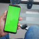 young man hand using smart phone with green screen inside of metro train - PhotoDune Item for Sale