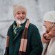 Close-up of elegant senior man walking with his wife in the snowy park. - PhotoDune Item for Sale