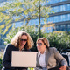 businessman and woman working outdoors with laptop - PhotoDune Item for Sale
