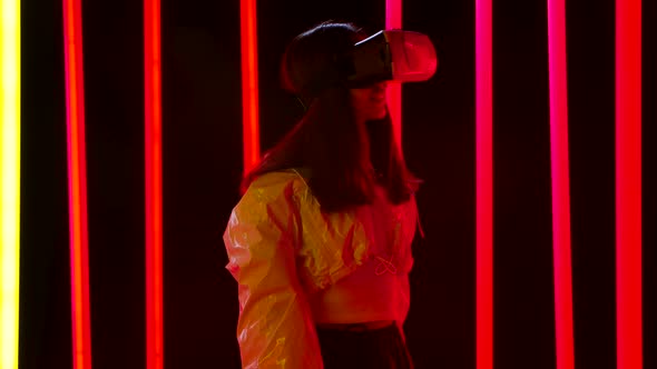 Portrait of a Pretty Young Beautiful Woman with Virtual Reality Goggles. Slow Motion. alt
