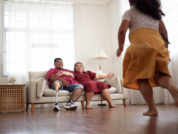 Family father mother dad mom son girl boy kid child baby group people indoor living room sofa run wa