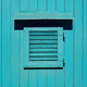 Wooden window with closed shutters on blue shed - PhotoDune Item for Sale