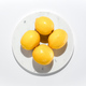 Fresh lemons on marble circle background - PhotoDune Item for Sale