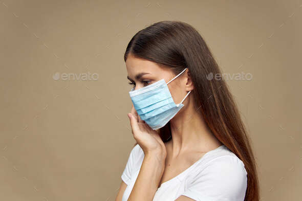 Pretty woman fashion clothes in a face mask health prevention
