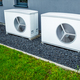 Two air source heat pumps installed outside of new and modern city house, green renewable energy - PhotoDune Item for Sale