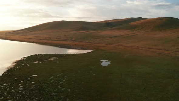 Aerial View of the Alpine SongKul Lake Lake at Sunrise Kyrgyzstan alt