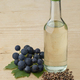 Glas bottle with grape seed oil and fresh grapes and seed - PhotoDune Item for Sale