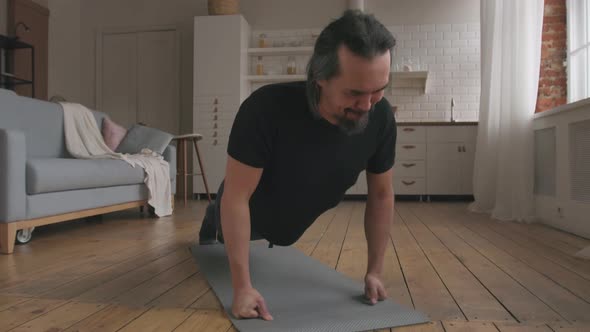 Middle Aged Man Doing Push-ups at Home