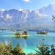 View Behind Coniferous Forest To Islands In Blue Lake With Trees On It On Mountains Background - PhotoDune Item for Sale