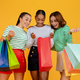 Excited multiracial ladies enjoying shopping together, checking purchases - PhotoDune Item for Sale