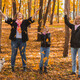 Grandmother and mother with granddaughter throw up fall leaves in autumn park and having fun - PhotoDune Item for Sale