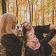 Mother, grandmother and little granddaughter with jack russell terrier dog taking selfie by - PhotoDune Item for Sale