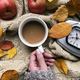 Overhead View Of Female Hand Holding Coffee Cup Surrounded By Autumn Leaves, Apples And Alarm Clock - PhotoDune Item for Sale