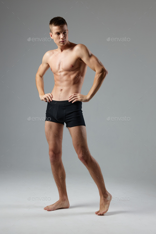 athletic men with a pumped-up muscular body black panties posing