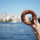 women holding a Turkish Bagel Simit against istanbul city background  - PhotoDune Item for Sale