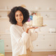 Birthday cake, woman and portrait at home with a smile from celebration and dessert in kitchen. Hap - PhotoDune Item for Sale