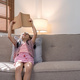 Little girl asian read a book on cozy sofa at home - PhotoDune Item for Sale