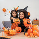 Happy family mother and child happy girl with Halloween at home together beautifully decorated - PhotoDune Item for Sale