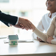 Real estate asian agent shakes hands with husband and wife customer finished contract after about - PhotoDune Item for Sale