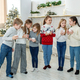 Merry Christmas and Happy Holidays. Children drinking hot chocolate at Christmas. - PhotoDune Item for Sale