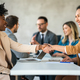 Business shaking hands, finishing up meeting. Successful businesswomen handshaking after good deal. - PhotoDune Item for Sale