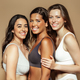 Positive millennial diverse women in underwear enjoy beauty care, isolated on beige background - PhotoDune Item for Sale