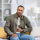 A young African American man is suffering from abdominal pain, stomach cramps and constipation. He - PhotoDune Item for Sale
