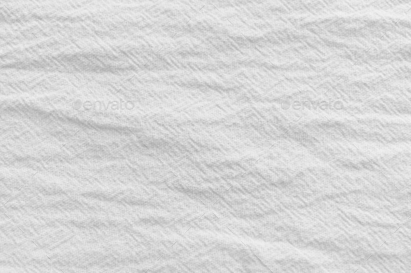 Wrinkled white fabric clothes background.
