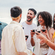 Group of young adult best friends talking, laughing and having fun together on a birthday party - PhotoDune Item for Sale