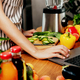 Female hand using laptop at kitchen. Food delivery, mobile dieting app - PhotoDune Item for Sale