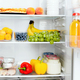 Open fridge or refrigerator door filled with fresh fruits, vegetables, juice - PhotoDune Item for Sale