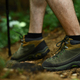 Male legs with hiker boots walking along the forest path. Traveling and adventure concept - PhotoDune Item for Sale