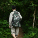 Male hiker with backpack walking along the forest path. Traveling, trekking and adventure concept. - PhotoDune Item for Sale