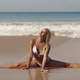 Stretching Leg-split on Seashore of Tanned Bikini Beach Woman - PhotoDune Item for Sale