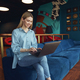 Young woman freelancer in business casual clothes working on laptop while sitting in coworking - PhotoDune Item for Sale