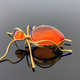 vintage brooch &quot;Ant&quot; with of amber and brass, made in USSR on dark glossy background - PhotoDune Item for Sale