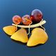 vintage brooch berries and leaves with of amber and brass, made in USSR on dark glossy background - PhotoDune Item for Sale