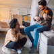 Multiethnic couple is spending romantic moments together. Man playing the violin for his girlfriend - PhotoDune Item for Sale