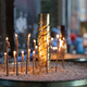 Burning candles in the sand in a church. - PhotoDune Item for Sale