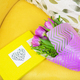 beautiful violet bouquet of tulips on a yellow stool and yellow book - PhotoDune Item for Sale